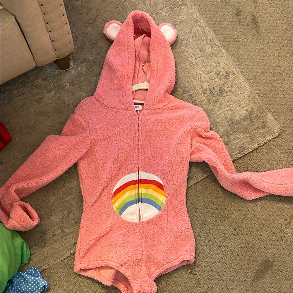 Adult Costume, XS, Care Bears Pink Fleece Bodysuit with Rainbow Patch.